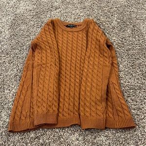 Burnt orange sweater in size small.